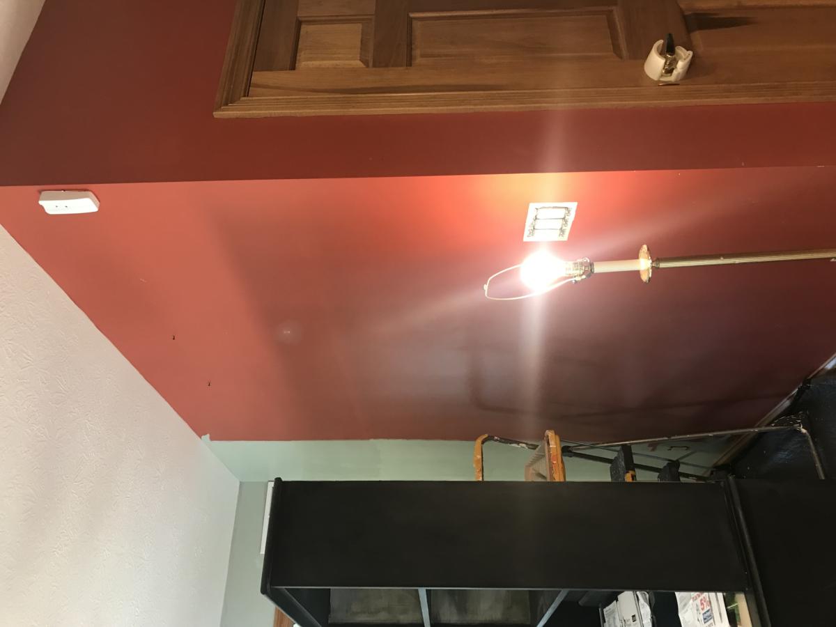 Behind the cabinet...